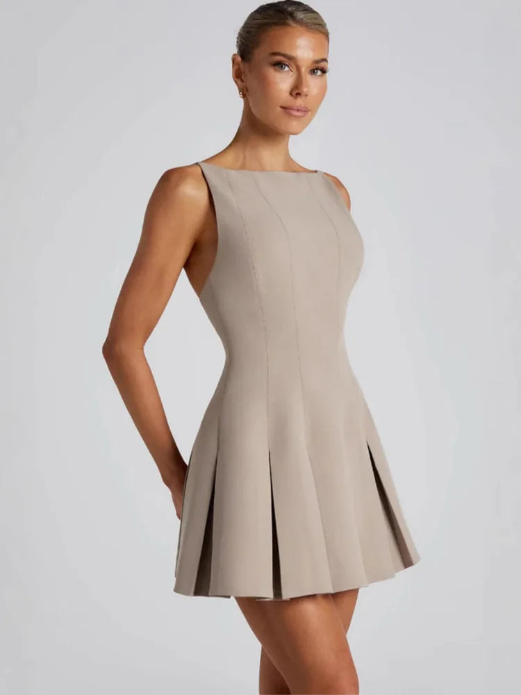 Backless Elegance – Spaghetti Strap Pleated Mini Dress