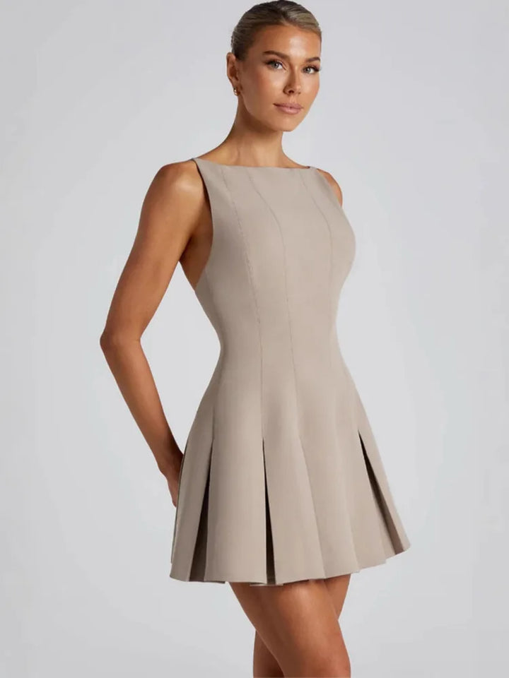 Backless Elegance – Spaghetti Strap Pleated Mini Dress