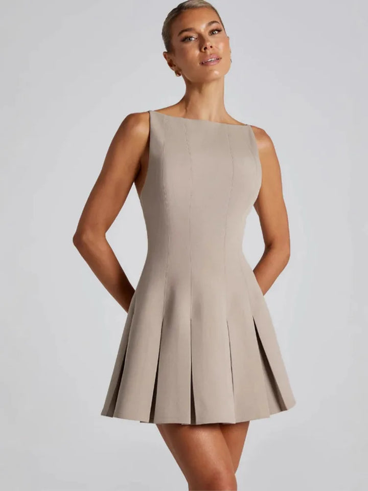Backless Elegance – Spaghetti Strap Pleated Mini Dress